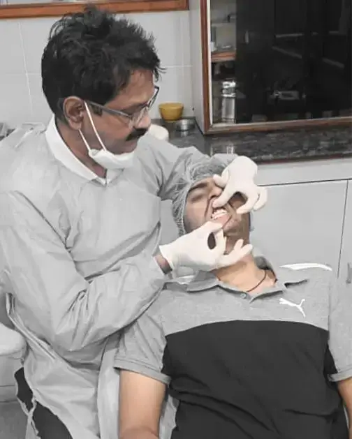 Dr. G. Vivekananda Reddy in conversation with a patient at Hyderabad Dental